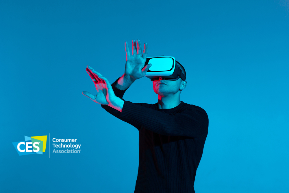 extended reality headset on man with hands in front of him and CES 2023 logo in bottom left corner